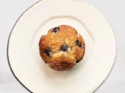 First Watch Blueberry Muffin - a freshly baked muffin bursting with sweet blueberries and a golden-brown top.