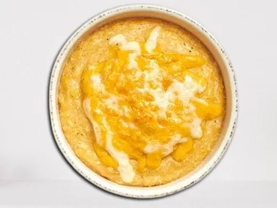 First Watch Bob's Red Mill Cheesy Grits - creamy stone-ground grits blended with Cheddar cheese and butter.