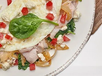 First Watch Healthy Turkey - egg white omelet with turkey, spinach, feta cheese, and tomatoes.