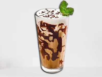 First Watch Mint Mocha Iced Coffee in a glass with mint garnish