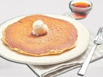 First Watch Multigrain Pancake - fluffy multigrain pancakes served with whipped butter and warm syrup.
