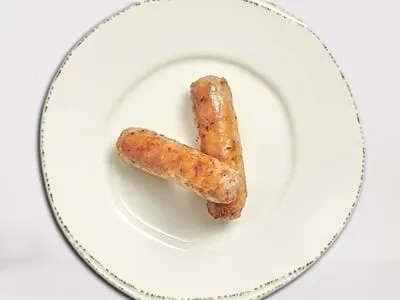 First Watch Pork Sausage - two savory pork sausage links, perfectly seasoned and cooked to golden brown.