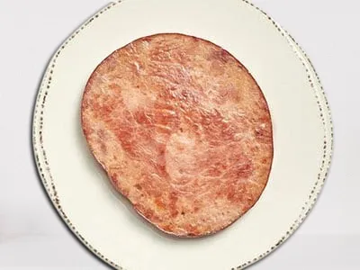 First Watch Smoked Ham - savory and tender smoked ham slices served as a classic breakfast side.
